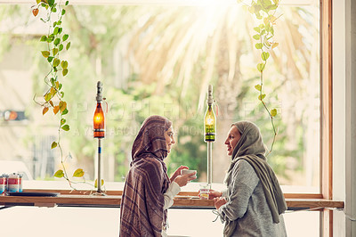 Buy stock photo Shot of two women chatting over coffee in a cafe