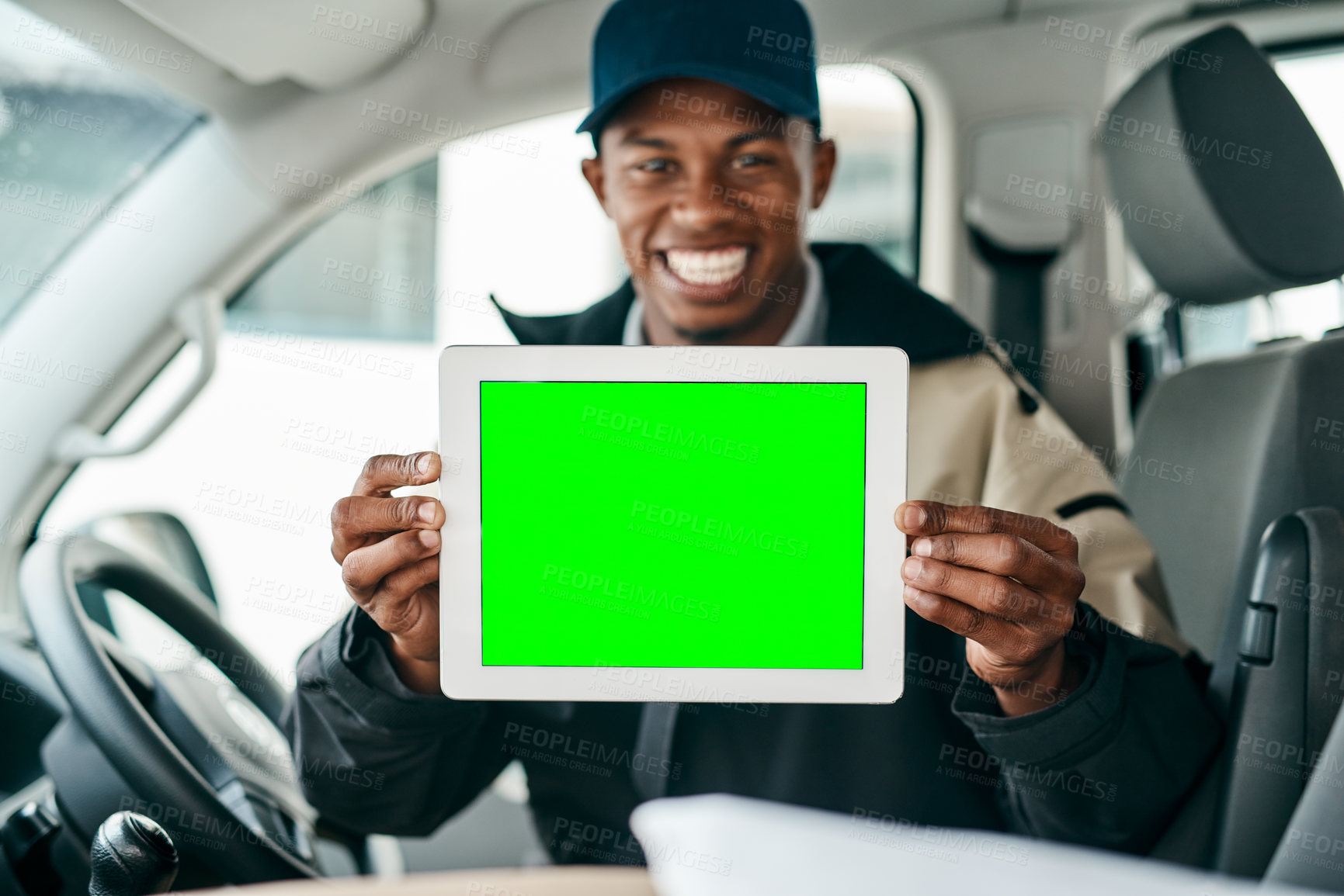 Buy stock photo Portrait of a courier holding a digital tablet with a chroma key screen inside a delivery van
