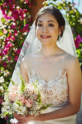 Buy stock photo Portrait of a cheerful young bride holding a bouquet of flowers while standing outside during the day