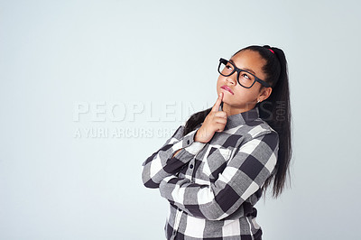 Buy stock photo Thinking, girl and option decision with idea, choice and uncertain with style and fashion in studio. Youth, glasses and mockup space with kid and clever student with pre teen and grey background