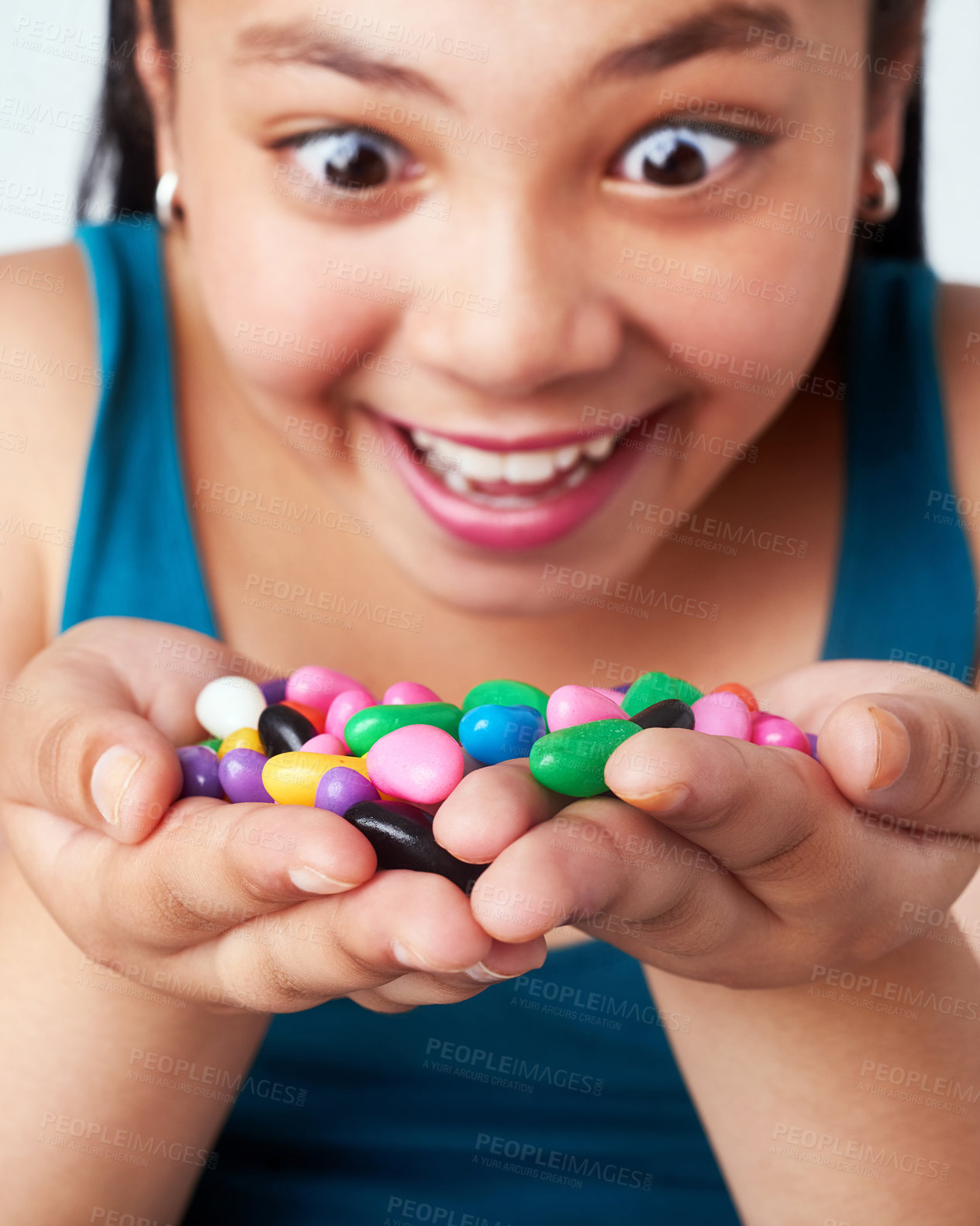 Buy stock photo Girl, candy or excited at omg, win or motivation for success, growth mindset or gratitude at dream. Female child, hand or jelly beans to smile, thinking or treasure of free reward for achievement