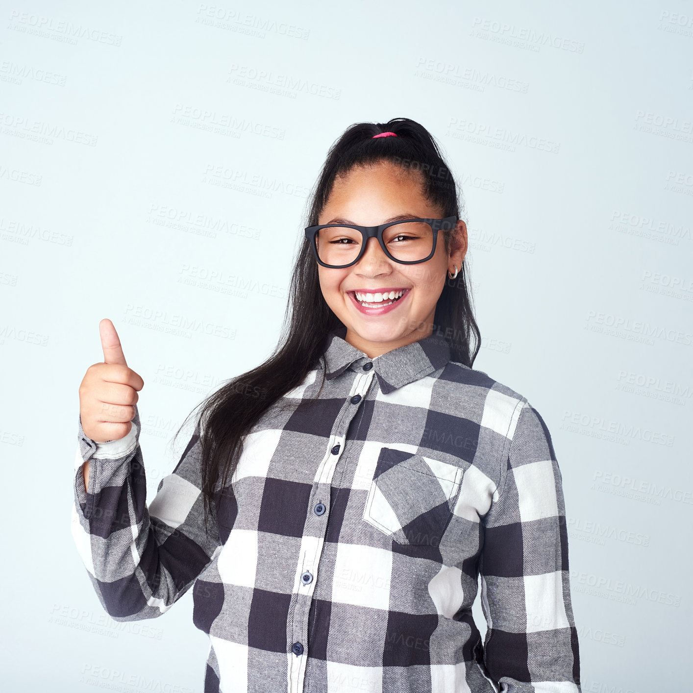 Buy stock photo Girl, portrait and child in studio with thumbs up for opinion, agreement and yes in mockup space. Happy, student and thank you emoji for support on project in school with feedback, review and vote 
