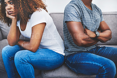 Buy stock photo Shot of a young couple having relationship problems at home