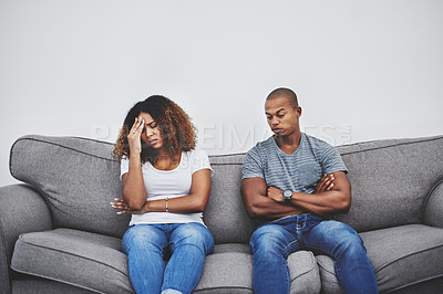 Buy stock photo Shot of a young couple having relationship problems at home