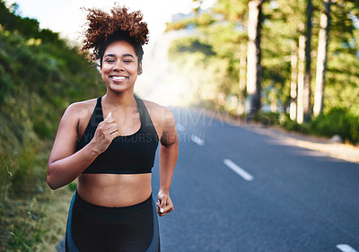 Buy stock photo Cropped shot of a beautiful young woman out for her morning run