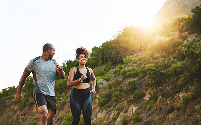 Buy stock photo Fitness, nature and couple walking by a mountain training for a race, marathon or competition. Sports, exercise and African athletes or runners doing outdoor running cardio workout together at sunset