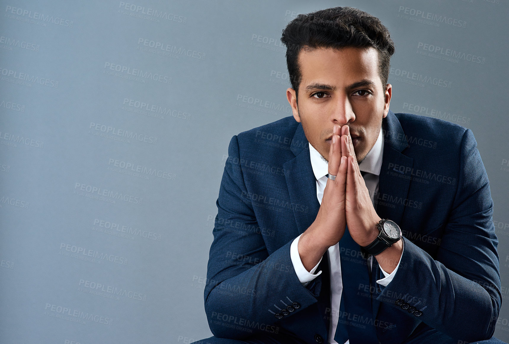 Buy stock photo Studio shot of a corporate businessman posing against a grey background