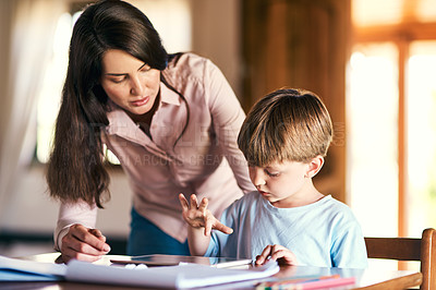 Buy stock photo Mother, boy and helping with tablet for education, support and care for preschool, learning and growth. Woman, son and home for homework on tech for language, math and skills for child development