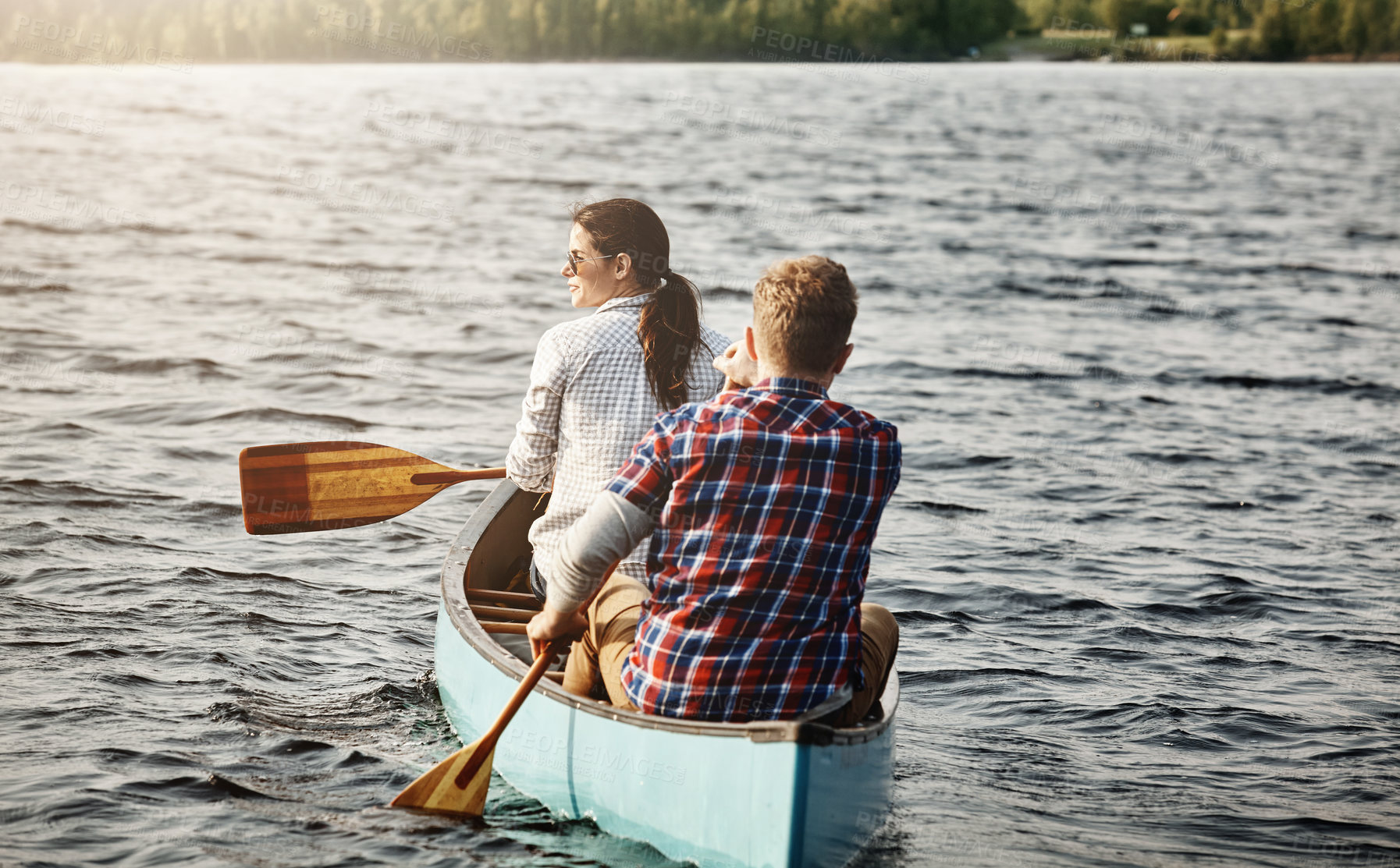 Buy stock photo Couple, kayak and rowing on lake for holiday, travel and adventure for activity on river. Paddle, water sports and vacation in Germany, sunshine and nature for married people on boat for fitness