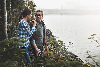 Buy stock photo Shot of a young couple exploring nature together
