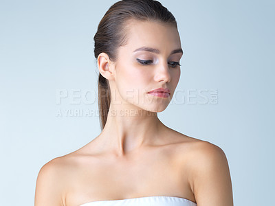 Buy stock photo Beauty, skincare and serious face of woman in studio isolated on blue background salon makeup. Cosmetics, beautiful model from Germany, spa facial and treatment for fresh, clean skin glow with mockup
