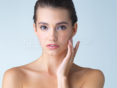 Buy stock photo Skincare, cosmetics and portrait of young woman in studio isolated on blue background in salon makeup. Beauty, portrait of model from Spain and spa facial treatment for fresh clean skin with mockup.