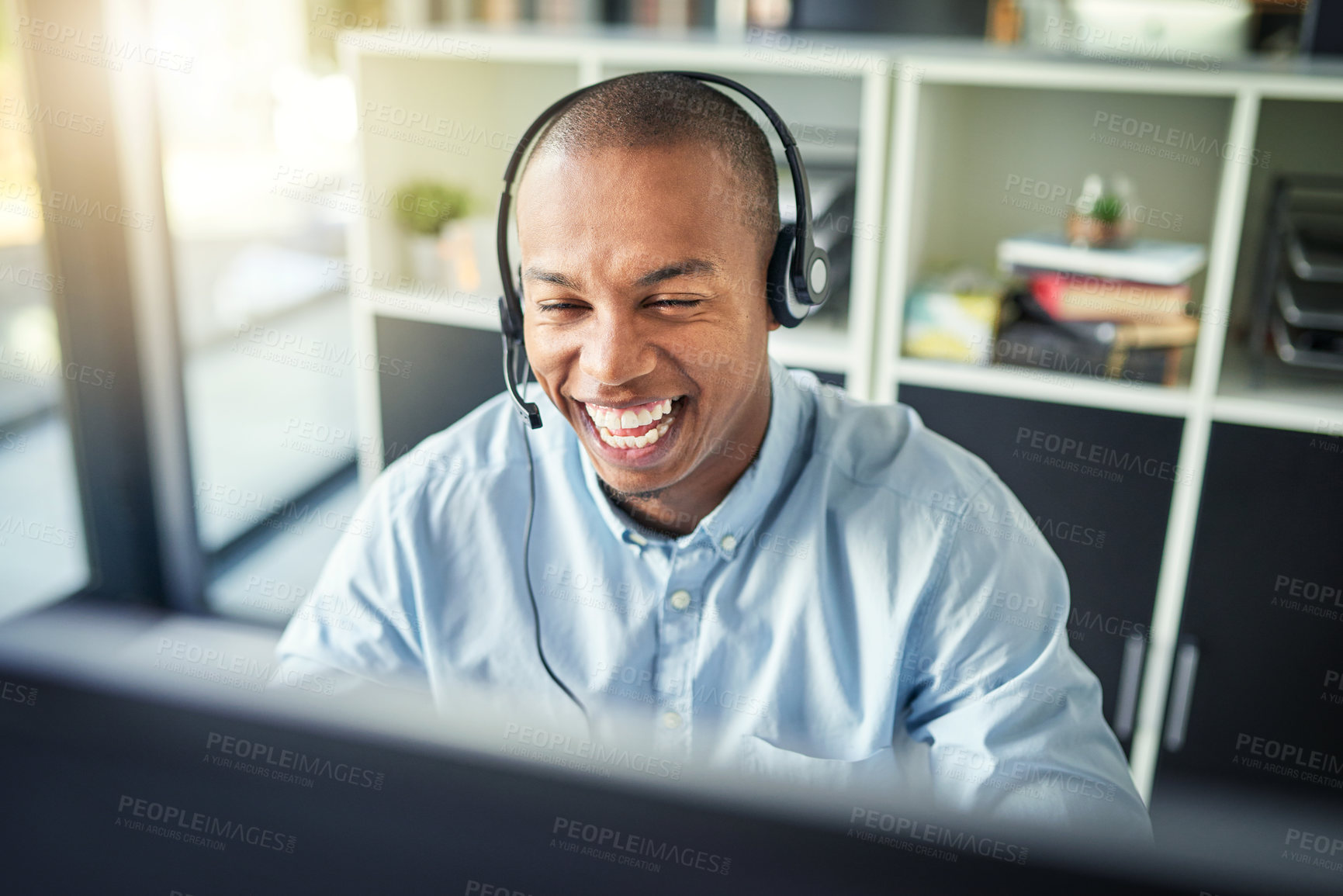 Buy stock photo Cropped shot of a young handsome male customer support agent working in the office