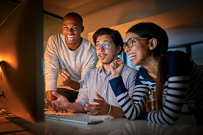 Buy stock photo Shot of computer programmers working together late in the office