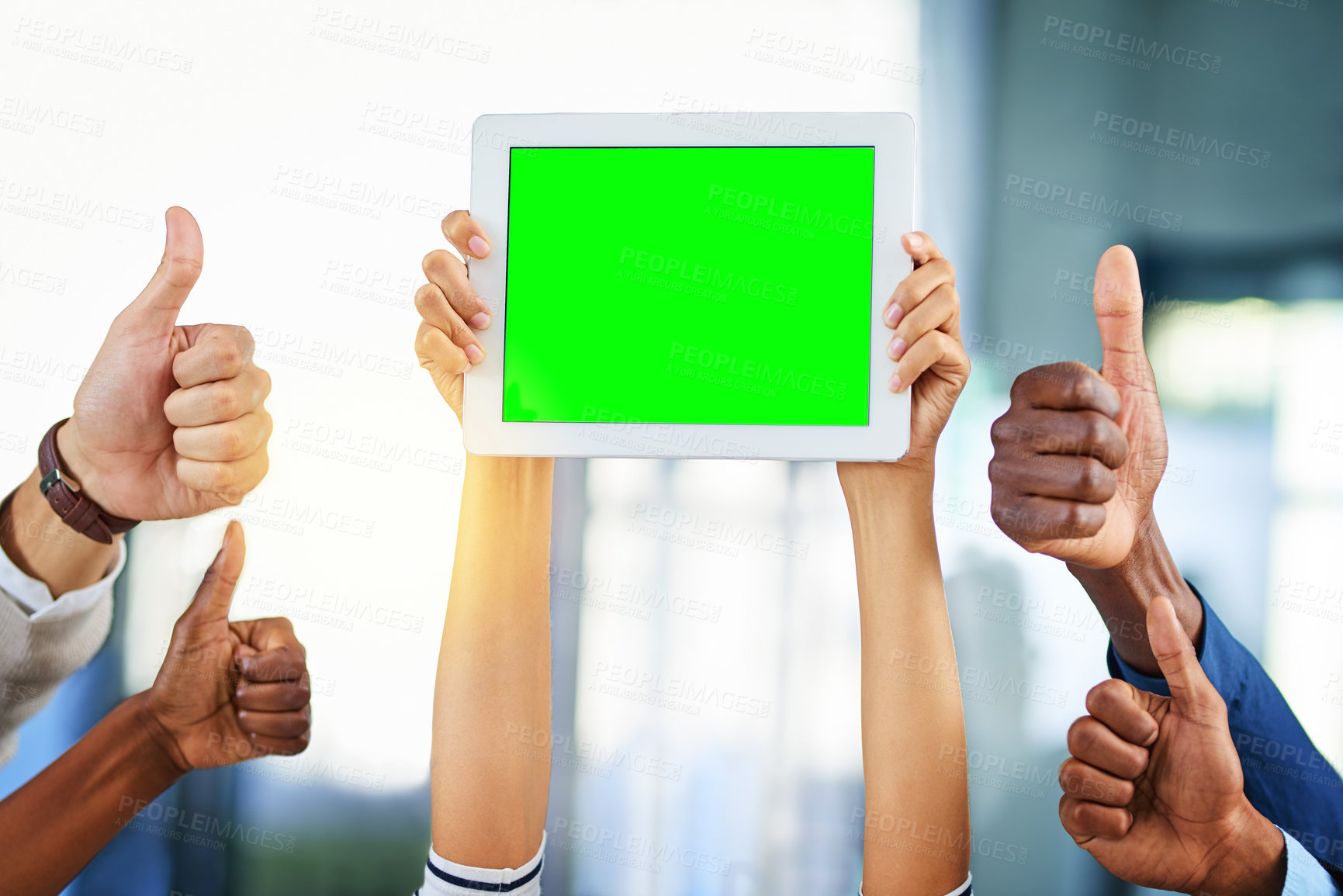 Buy stock photo Cropped shot of a group of businesspeople giving thumbs up and holding a digital tablet in a modern office