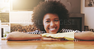 Buy stock photo Portrait of a cheerful young woman resting with her hands on a table while wearing yellow cleaning gloves at home during the day
