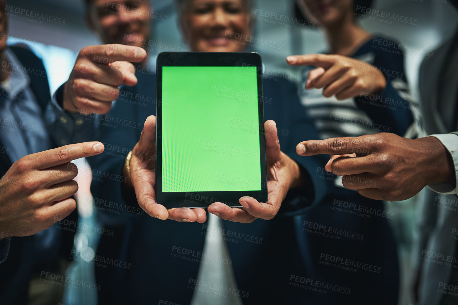 Buy stock photo Shot of a group of businesspeople pointing to a digital tablet with a chroma key screen