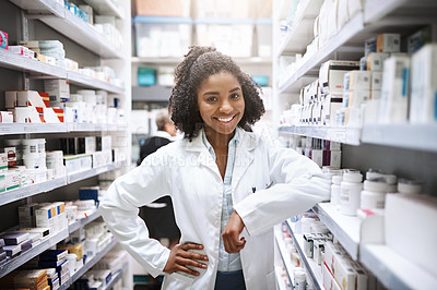 Buy stock photo Healthcare, pharmacist and black woman in shop, portrait and inventory of shelf with medicine for shortage. Pharmacy, proud and person in coat, smile and happy with oath to save lives in store