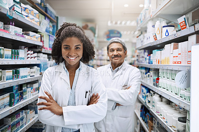 Buy stock photo Cropped portrait of two pharmacists standing together with their arms crossed in a pharmacy