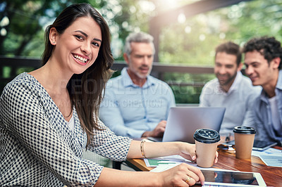Buy stock photo Cropped portrait of an attractive young businesswoman sitting outdoors at a cafe during a meeting