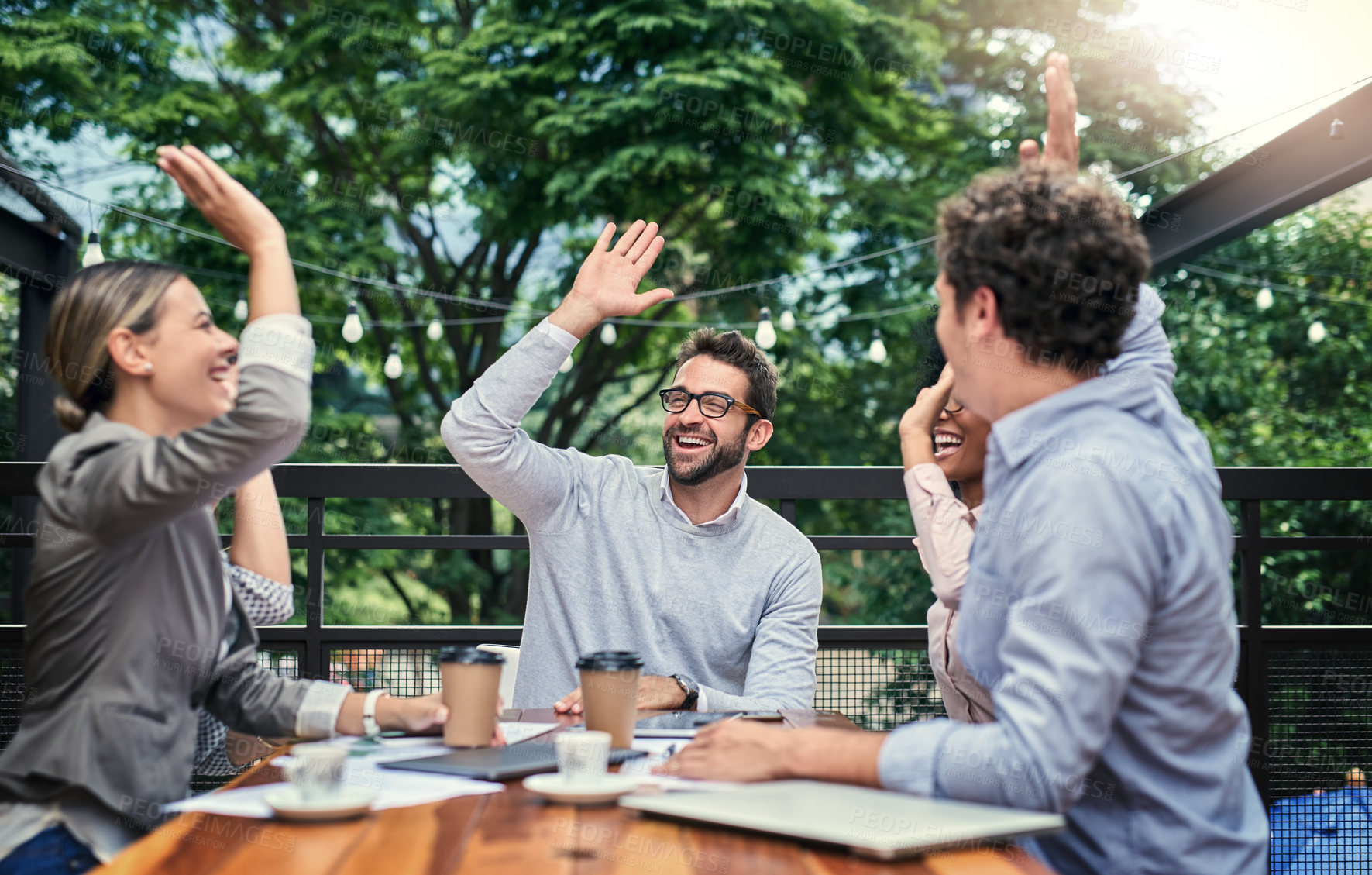 Buy stock photo Business people, high five and celebrate at cafe meeting, communication and agreement on deal. Employees, team building and support or motivation for goals, achievement and coffee shop for sales win