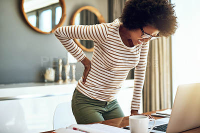 Buy stock photo Black woman, laptop and back pain in remote work from bad posture, stress or overworked strain at home. African female person or freelancer holding painful area in discomfort, spine or ache by desk