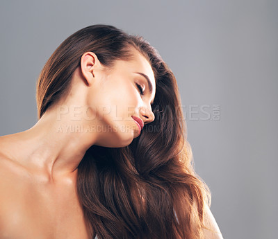 Buy stock photo Salon, hairstyle and texture with woman in studio for glow, beauty and hair gloss treatment. Scalp health, makeup and growth with person on gray background for haircare cosmetics, volume and keratin