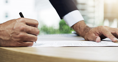 Buy stock photo Closeup shot of an unidentifiable businessman going through paperwork in an office