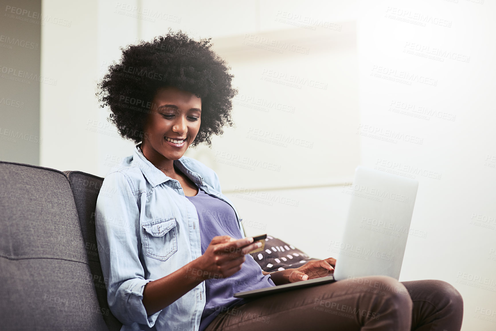 Buy stock photo African woman, laptop and credit card on sofa in house for ecommerce, payment and online shopping. Female person, happy and digital banking for internet subscription, streaming and fast food order 