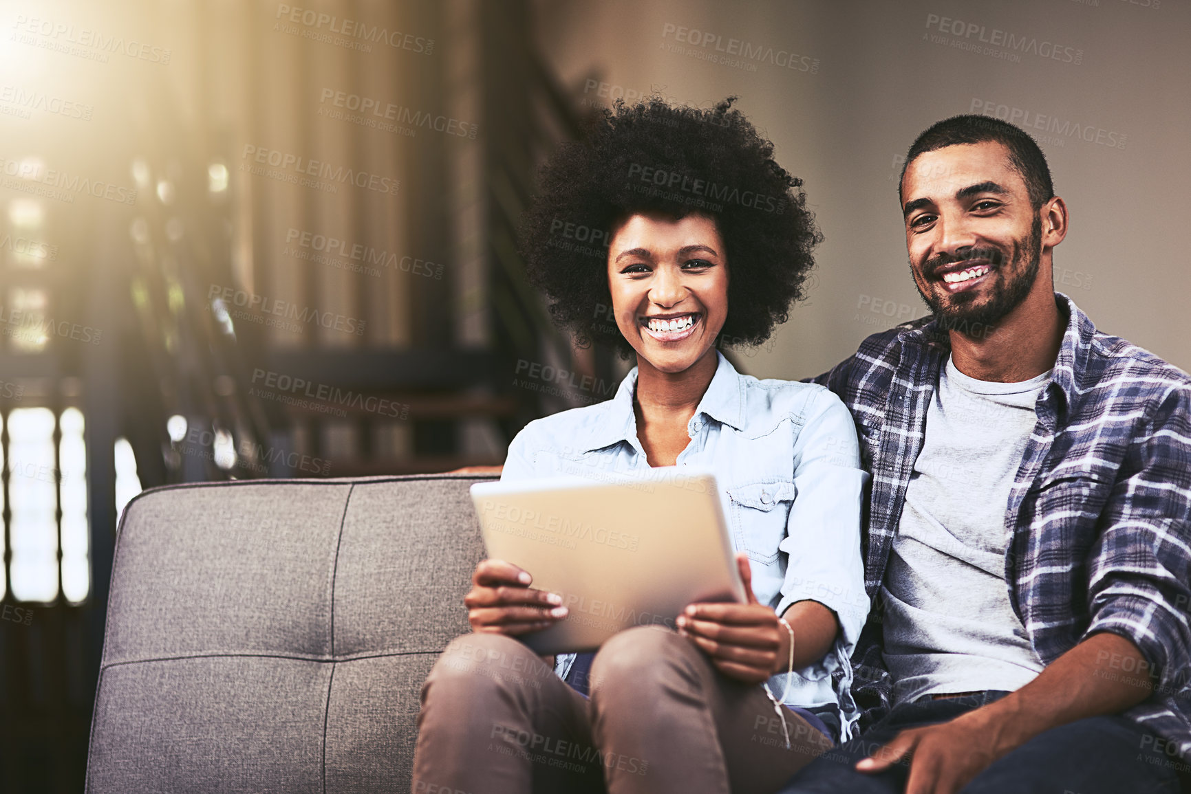 Buy stock photo Tablet, portrait and happy couple relax in home for online shopping, purchase and credit score. Technology, man and face of interracial woman in living room for love, care or bonding together on sofa