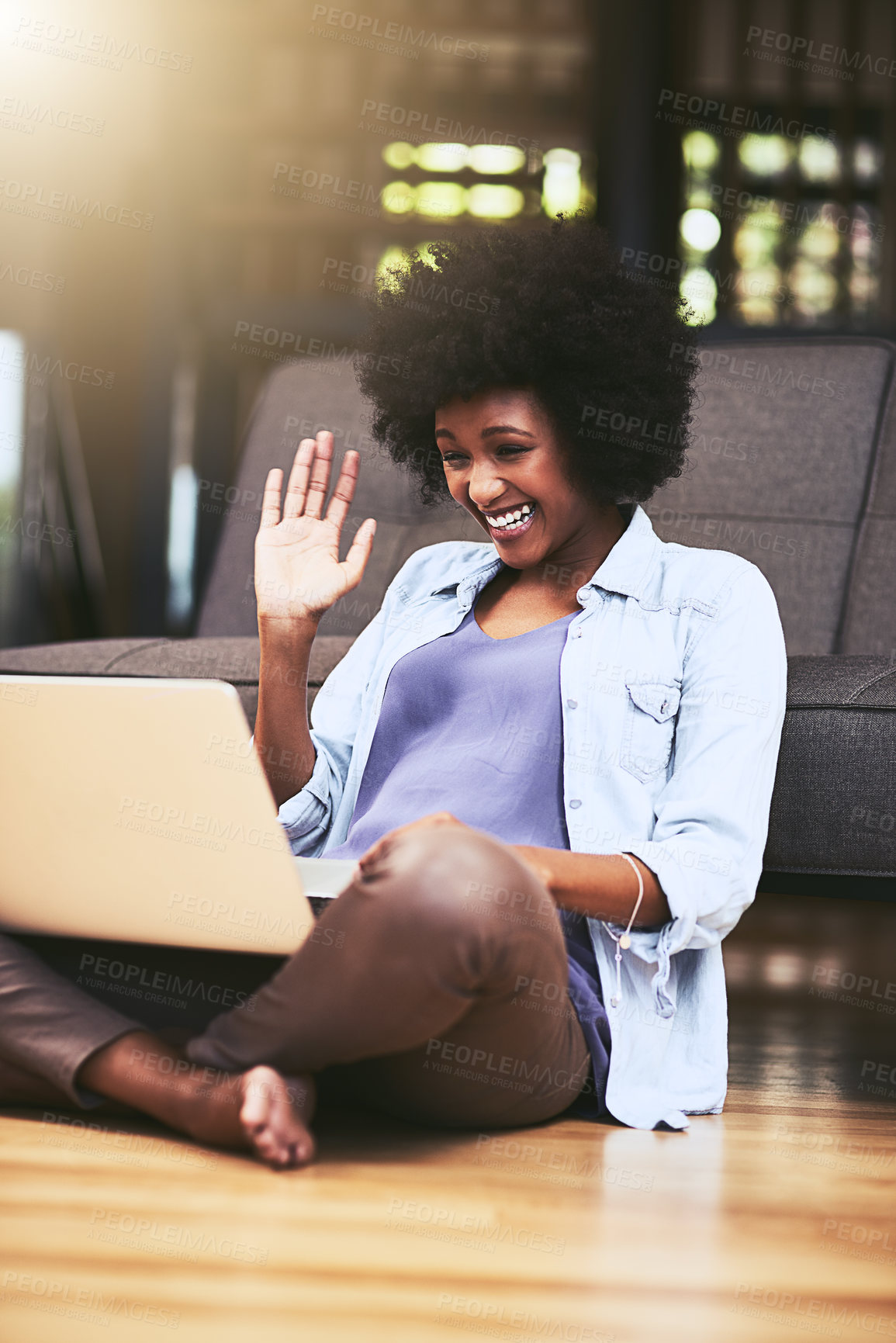 Buy stock photo Video call, wave and black woman in living room, smile and chilling on couch, talking and break in house. Laptop, communication and person on sofa and cheerful in lounge, greeting and contact in home
