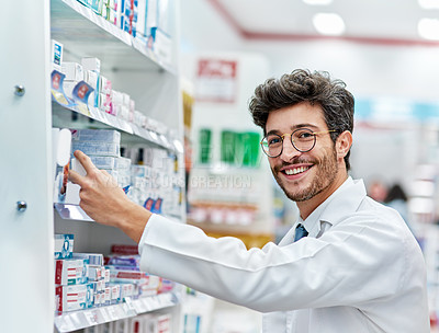 Buy stock photo Pharmacist, medicine and portrait of a man working in a pharmacy store for retail career with a smile. Male person in pharmaceutical or medical industry for service, healthcare and inventory on shelf