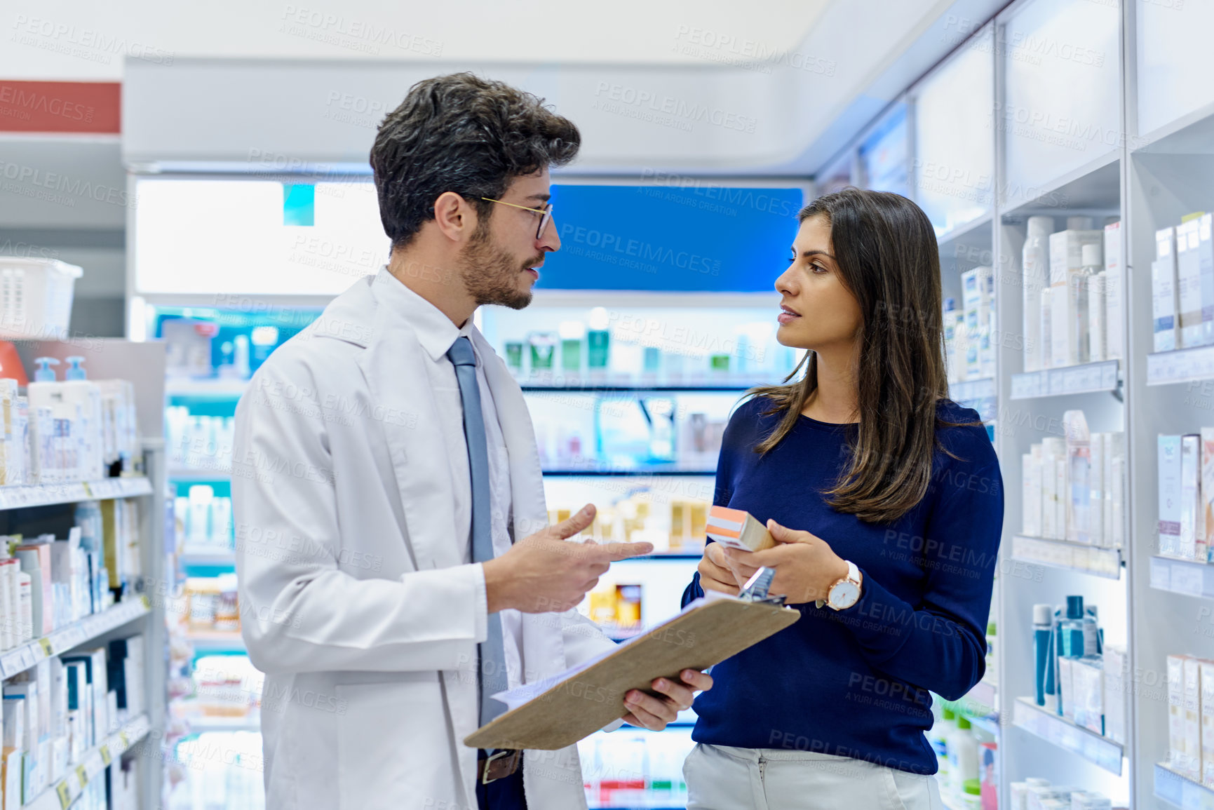 Buy stock photo Pharmacy, medicine and pharmacist talking to customer while working in a retail store. Professional man in pharmaceutical or medical industry for service, healthcare and advice for a woman client