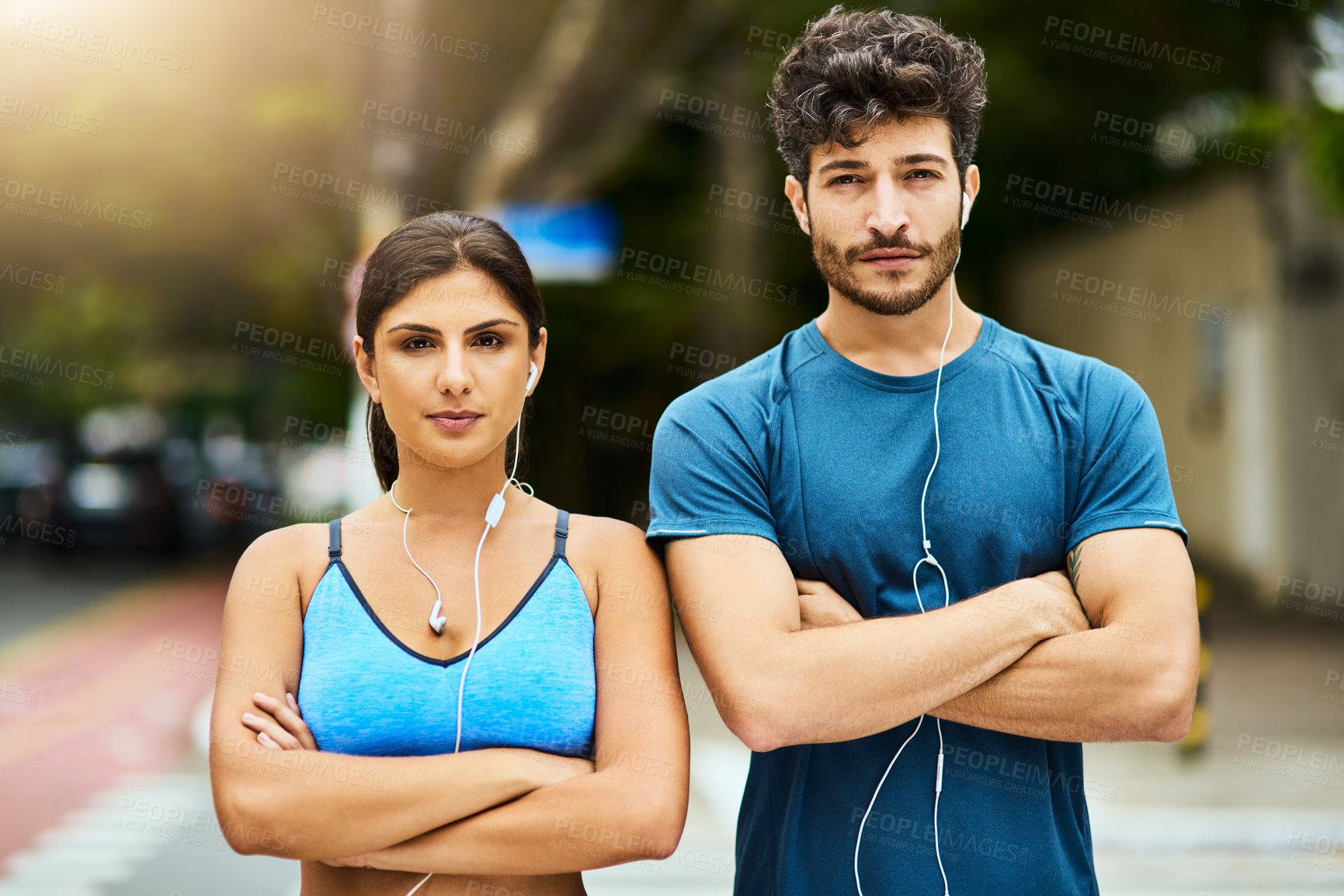 Buy stock photo Portrait, fitness couple and arms crossed outdoor for workout, pride and listen to music on earphones. Face, confident woman and sports man on street with determination for exercise and body health