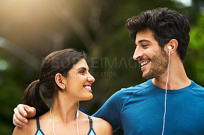 Buy stock photo Couple, love and earphones for music in nature, park and audio book for relax outdoor for walk. Fitness, exercise and cardio for Indian man and female person, smile and technology for sports workout