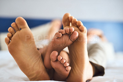 Buy stock photo Shot of a father and his little son's feet at home