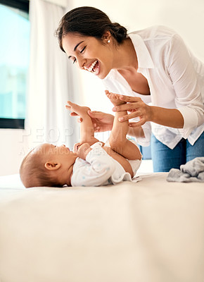 Buy stock photo Happy, love and a mother with her baby on the bed in their home together for playful bonding. Family, children and a young mama spending time with her newborn infant in the bedroom for fun or joy