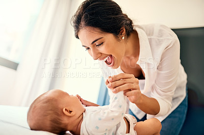 Buy stock photo Happy, children and a mother with her baby in the bedroom of their home together for playful bonding. Family, love and a young mama spending time with her newborn infant on the bed for fun or joy