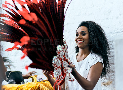 Buy stock photo Woman, costume and hat with feather for carnival, dancing tradition and expression of Brazilian culture. Home, female person and head piece with smile for celebration, festival and creative for event