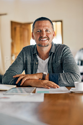 Buy stock photo Cropped shot of a man planning his family budget at home