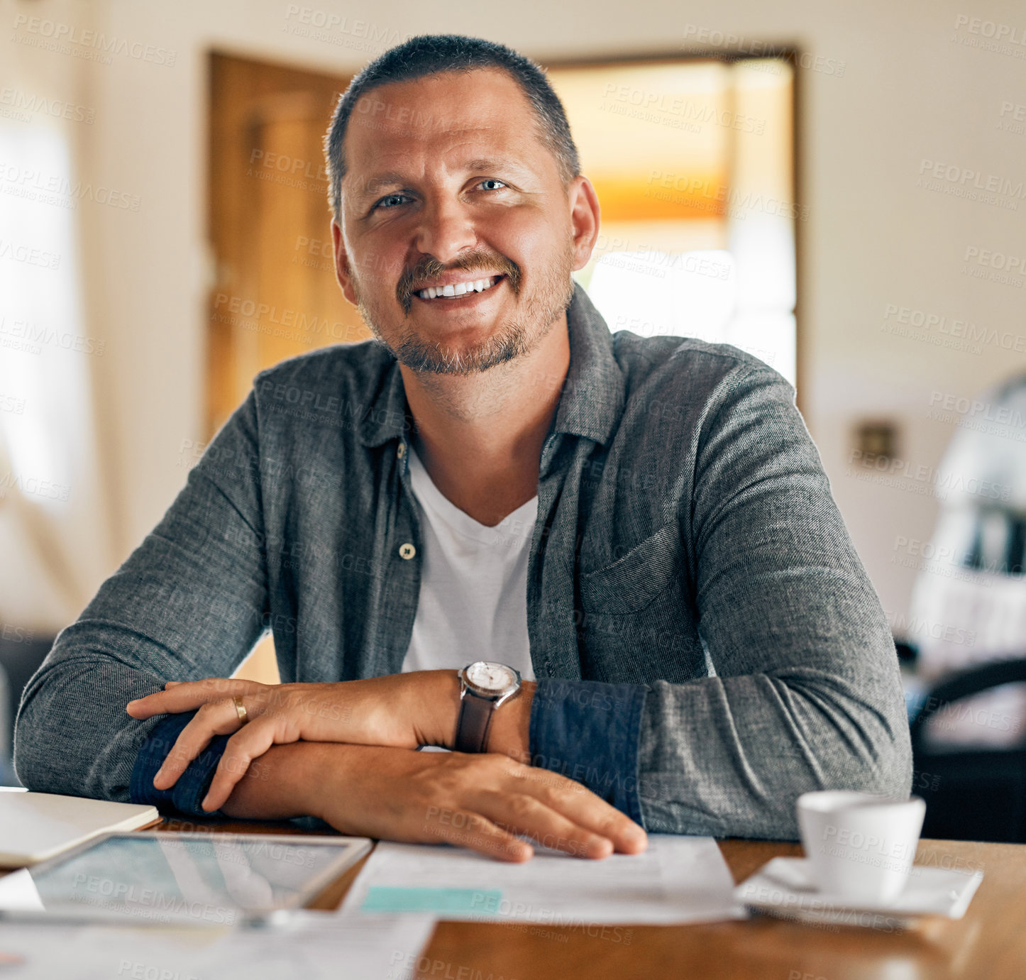 Buy stock photo Cropped shot of a man planning his family budget at home