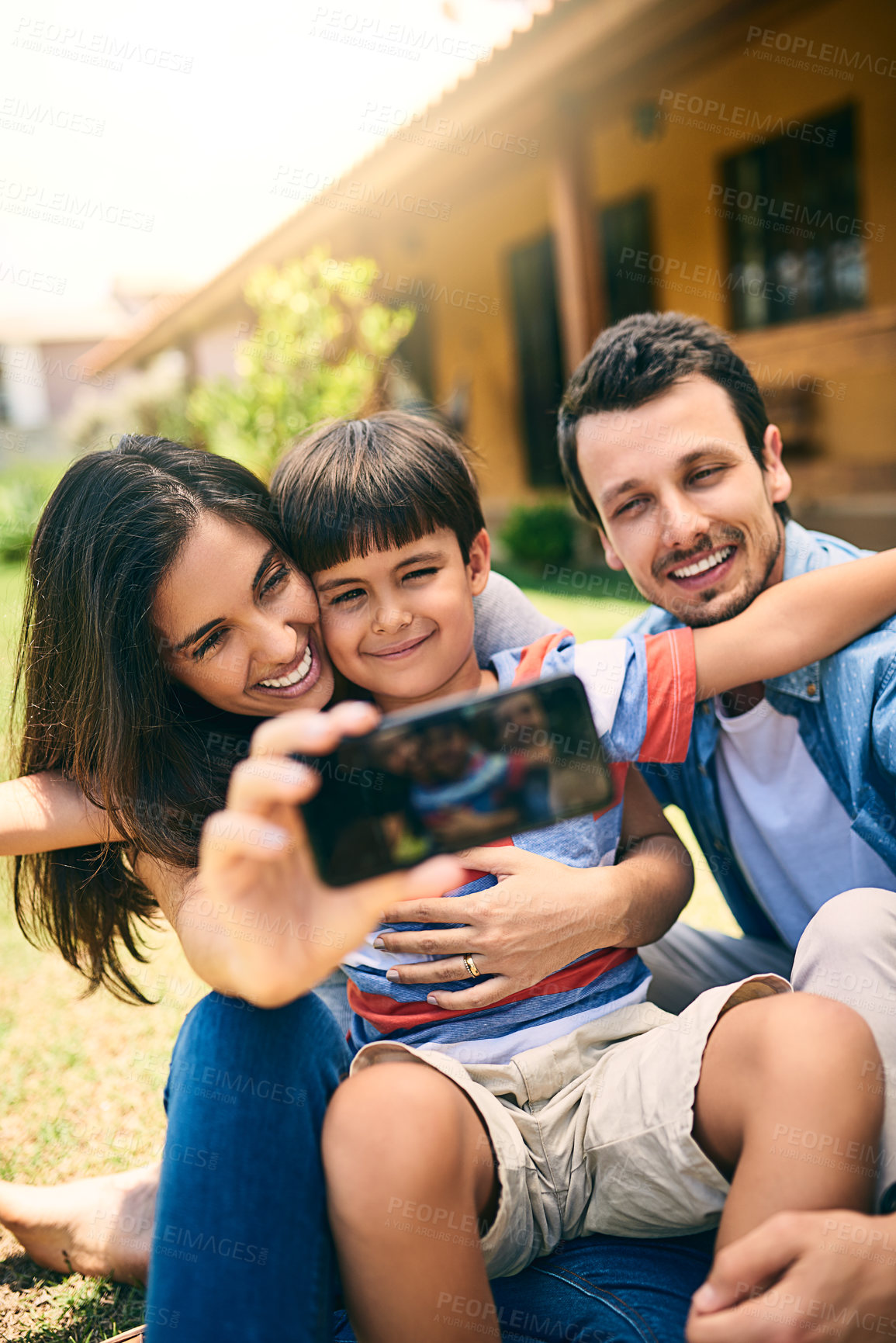 Buy stock photo Happy family, relax and smile for selfie, profile picture or photo in social media vlog outside home. Mother, father and child smiling for fun memory, online post or holiday weekend break together