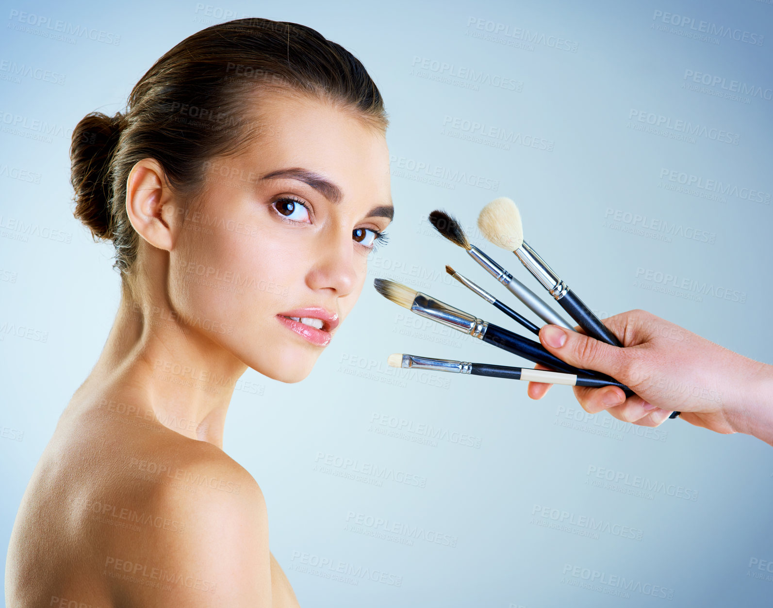 Buy stock photo Portrait, woman and makeup brushes for beauty with glow, pride and dermatology on studio backdrop. Female person, cosmetic tools and skincare for makeover, wellness and confidence in blue background