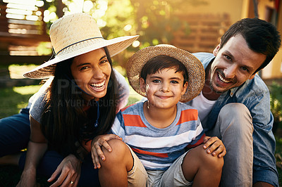 Buy stock photo Portrait of a happy family gardening together in their backyard