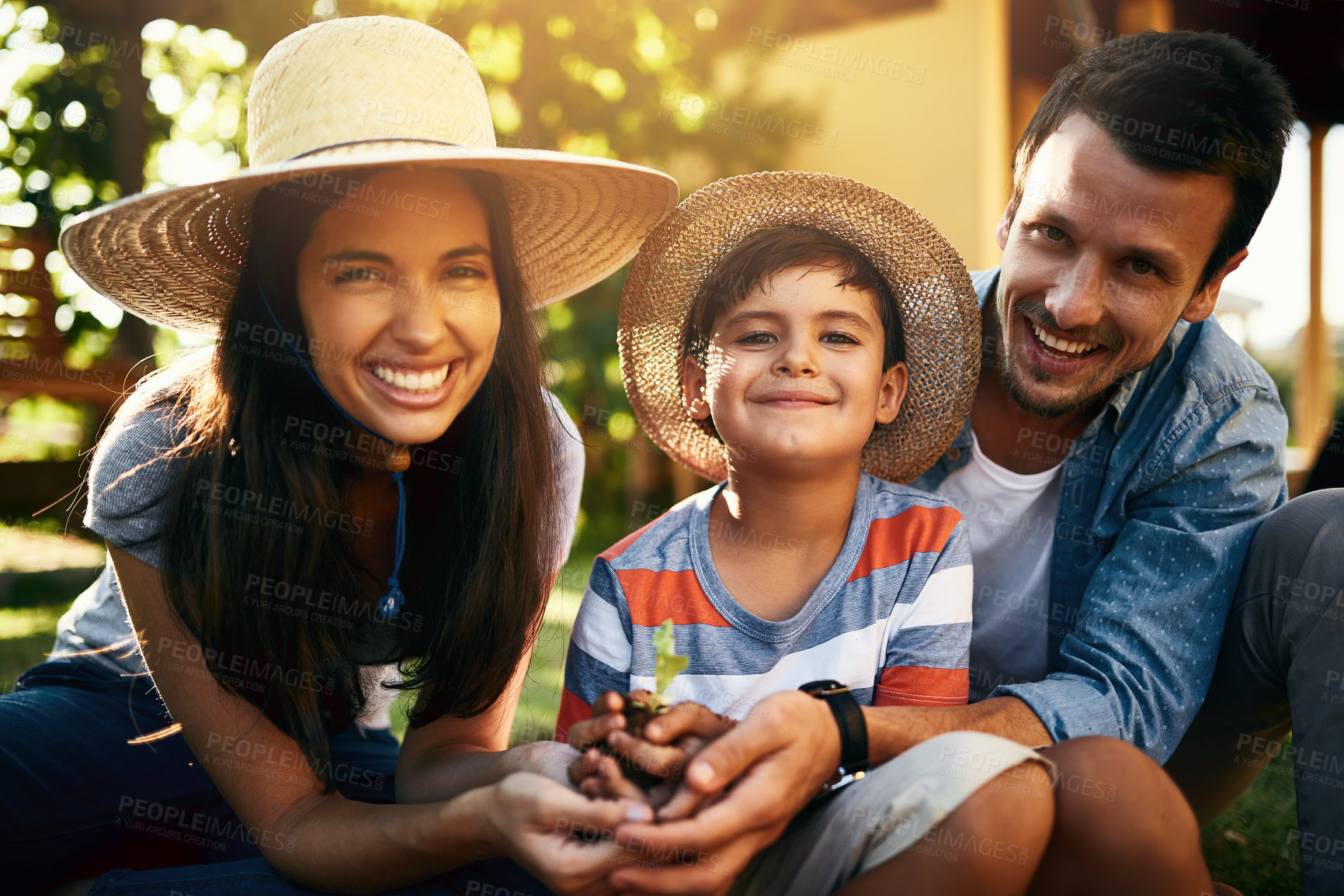 Buy stock photo Portrait of a happy family gardening together in their backyard