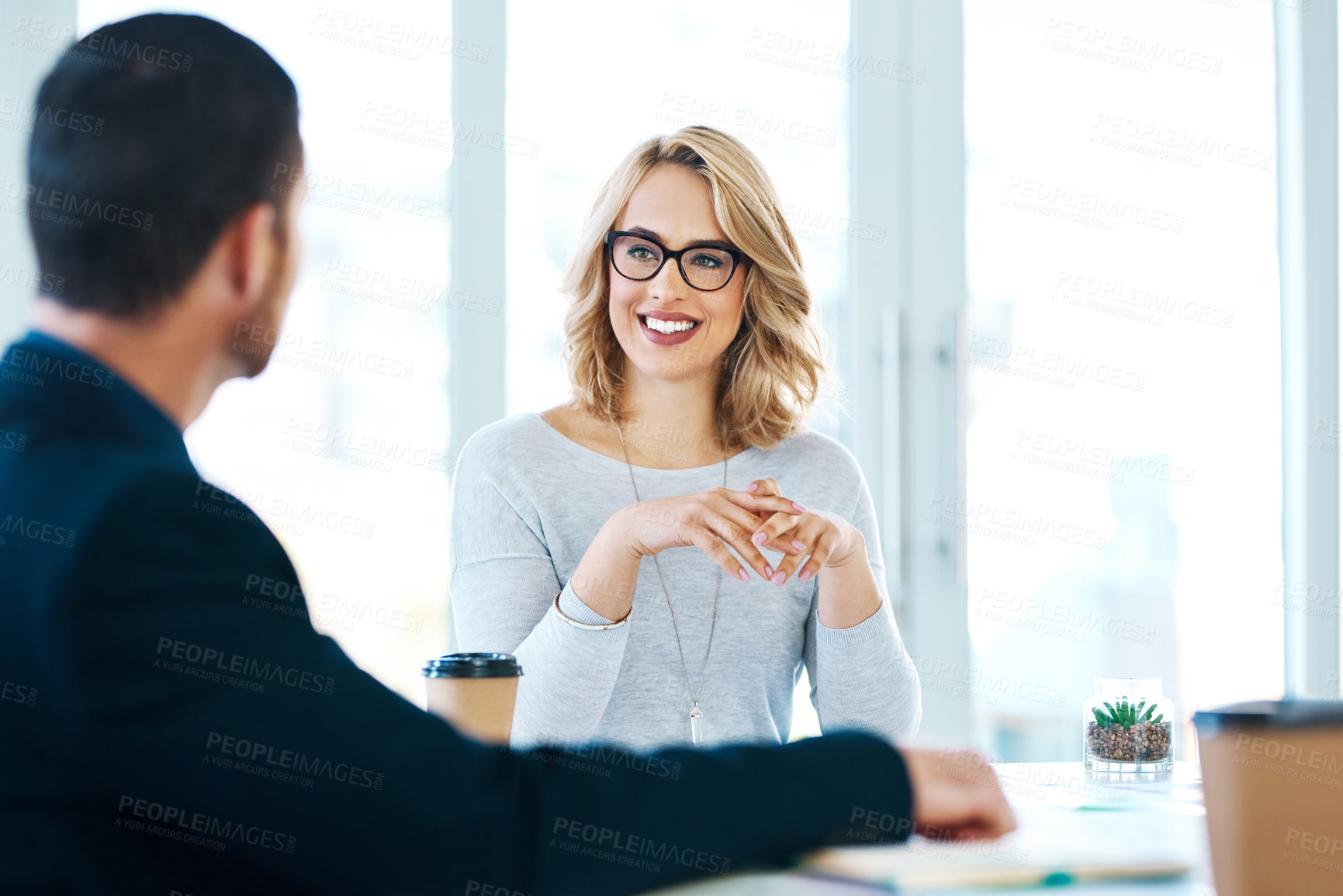 Buy stock photo Shot of two businesspeople having a meeting in an office