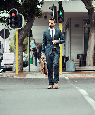 Buy stock photo Business man, walking and cross street in city by traffic light, safety and sign for direction to workplace. Person, suit and leather briefcase in metro for commute, travel or trip to job in Seattle