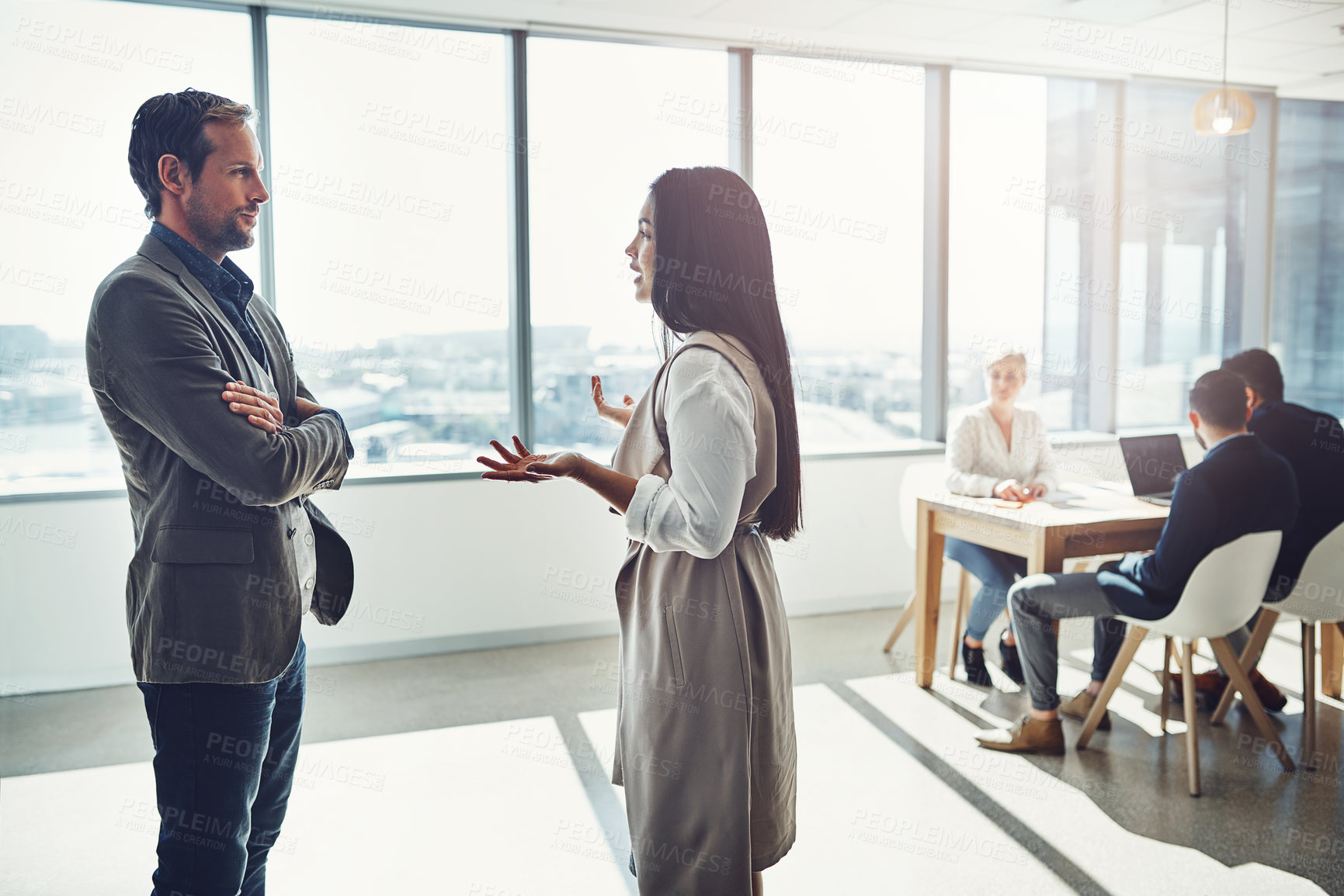 Buy stock photo Shot of businesspeople having a discussion in an office