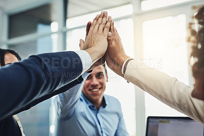 Buy stock photo Teamwork, partnership and fun with a diverse group joining hands for a high five during team building. Colleagues uniting and showing support, community and global collaboration in an office
