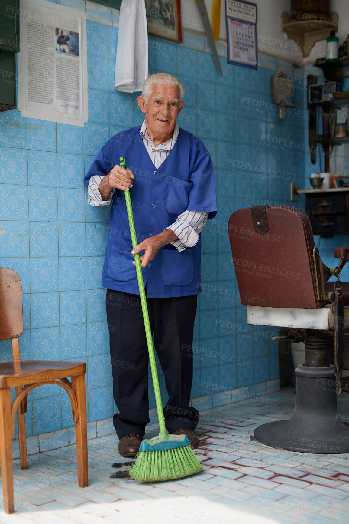 Buy stock photo Shot of a senior man working in his barber shop